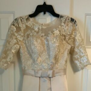 Never worn, brand new champagne colored evening /bridesmaid dress. Size 2